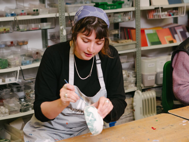 New mum crafting wearing apron